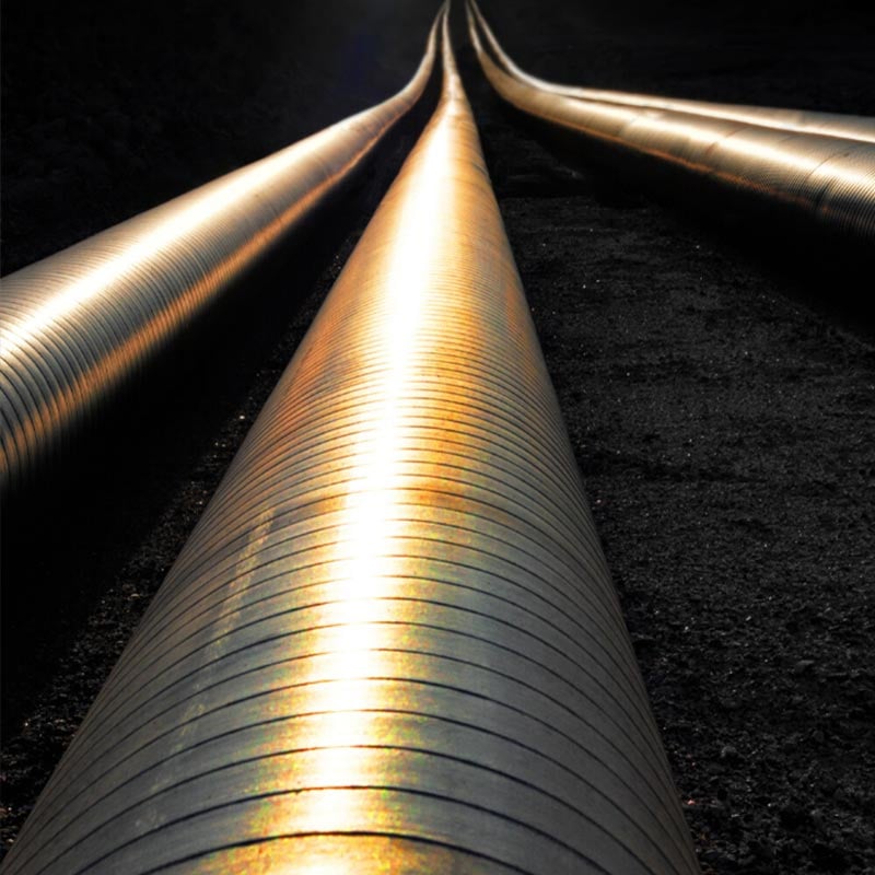 Three pipelines in the dirt at night time