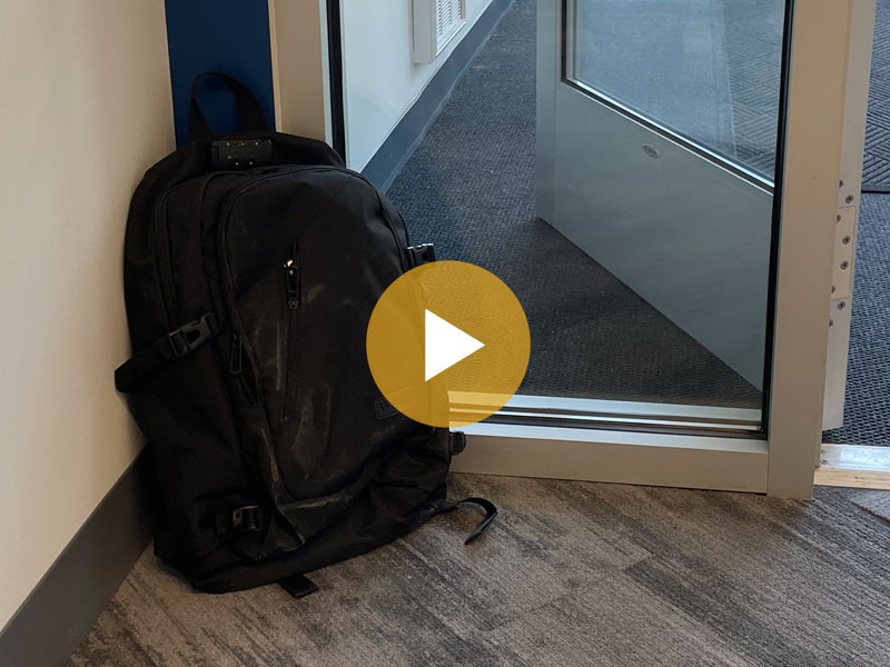 Image of an unattended backpack in a lobby.