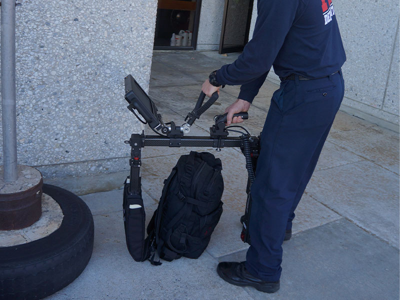 Bomb tech scanning unattended baggage