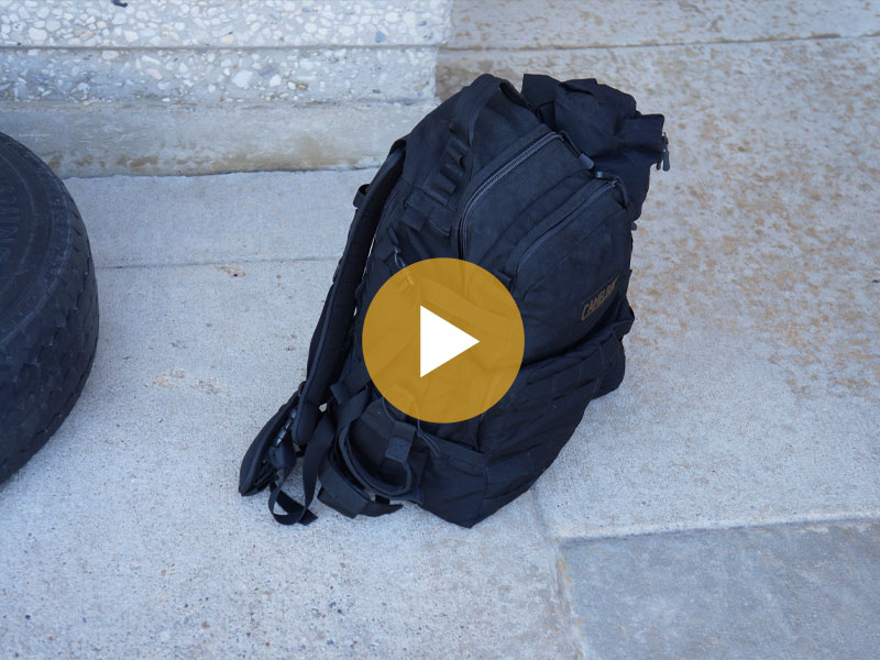 Unattended backpack left near a large corporate park. 